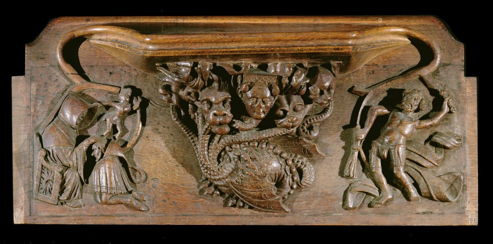 Eine Miserikordie, die eine kunstvoll geschnitzte Hydra darstellt, symbolisch für die sieben Todsünden, mit einem realistischen menschlichen Kopf, New College Chapel, Oxford, spätes 14. Jahrhundert von English School