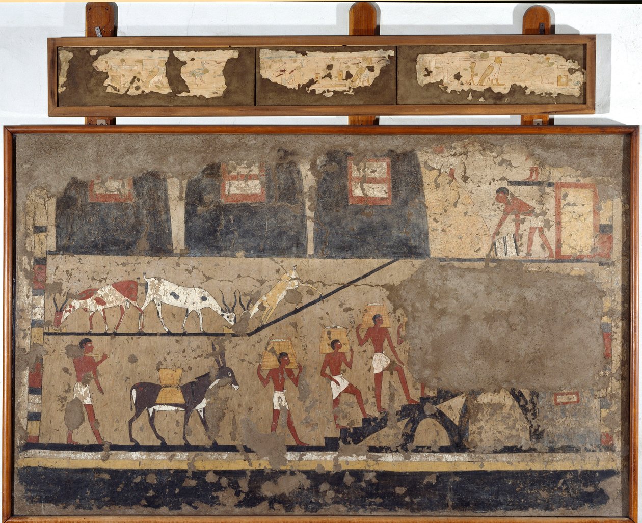 Ägyptische Antiquität: der Transport von Weizen auf dem Rücken von Maultieren und Menschen. Detrempe auf Ton und Stroh aus dem Grab des Generals und Kanzlers von König Iti in El Ghebelen bei Luxor. 2200-2000 v. Chr. Turin, Ägyptisches Museum von Egyptian Egyptian
