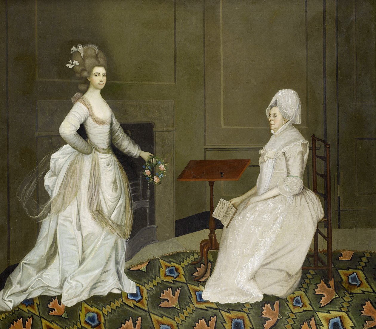 Zwei Damen in einem Innenraum, eine liest, die andere hält einen Blumenkranz von English School, 18th Century
