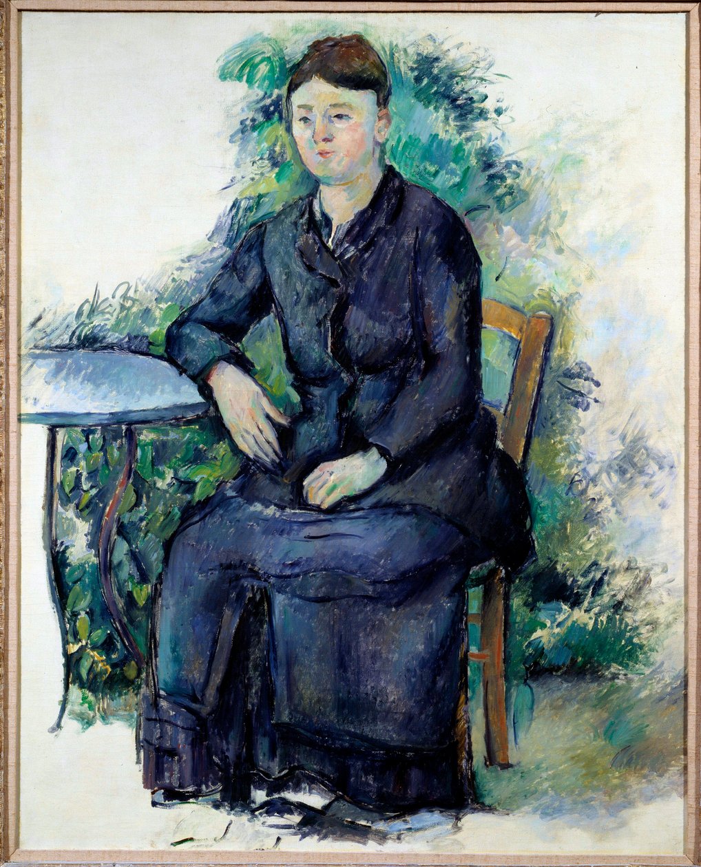 Porträt von Madame Cezanne in einem Garten von Paul Cézanne