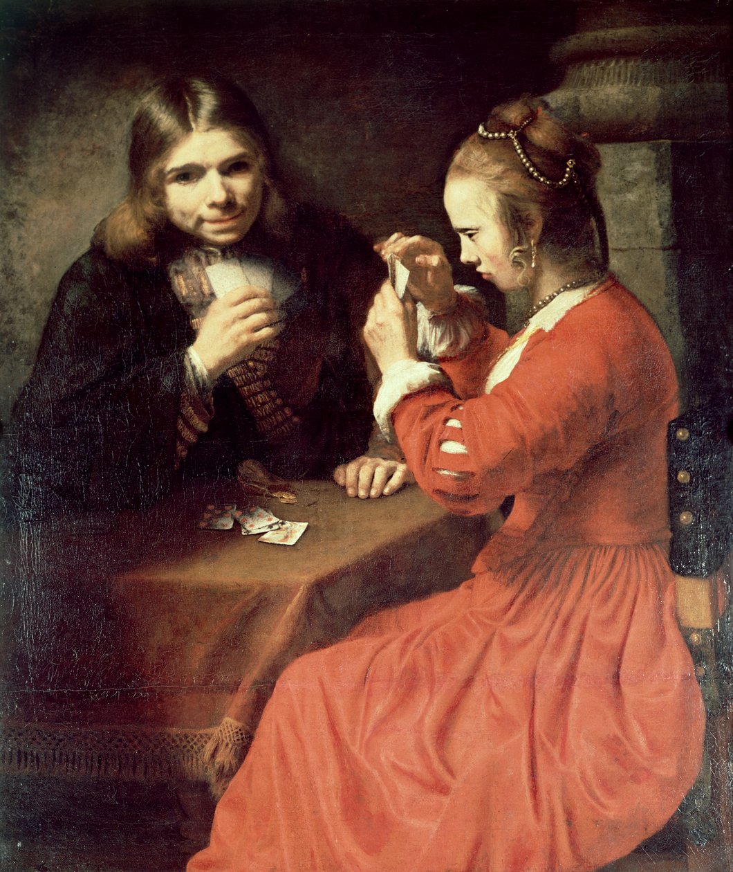 Ein junger Mann und ein Mädchen spielen Karten von Rembrandt van Rijn