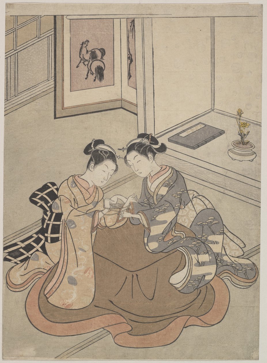 Zwei junge Frauen sitzen an einem Kotatsu und spielen Fadenspiel von Suzuki Harunobu