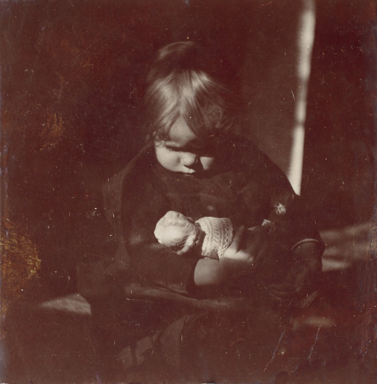 Betty Reynolds mit Puppe auf dem Schoß, ca. 1885 von Thomas Eakins
