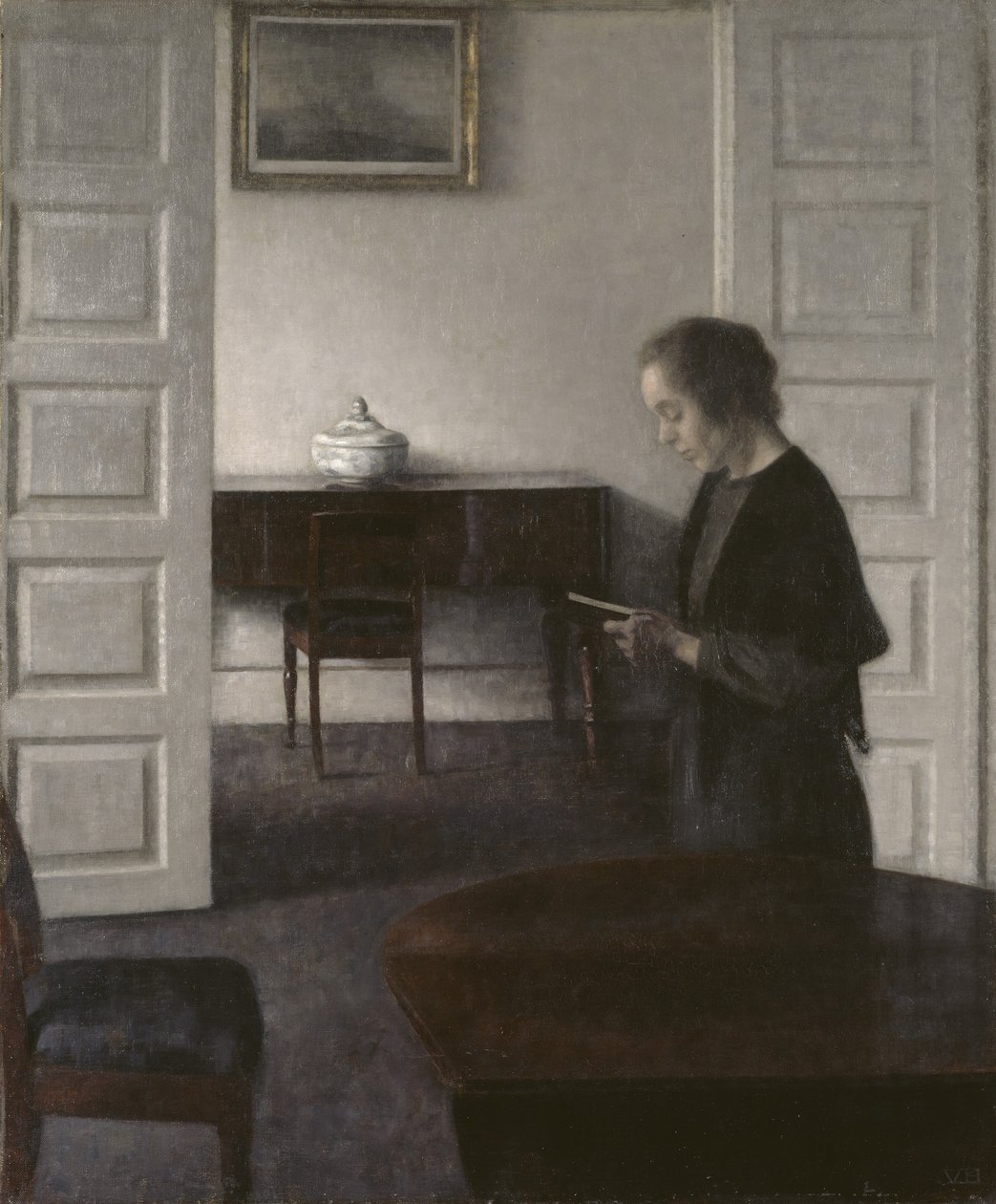 Interieur mit einer lesenden Dame von Vilhelm Hammershoi