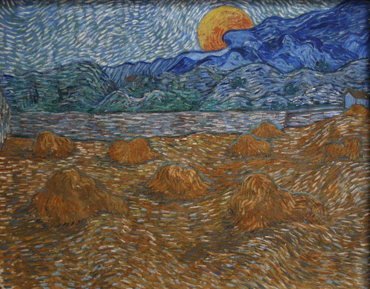 Landschaft mit Getreideschobern und aufgehender Mond von Vincent van Gogh