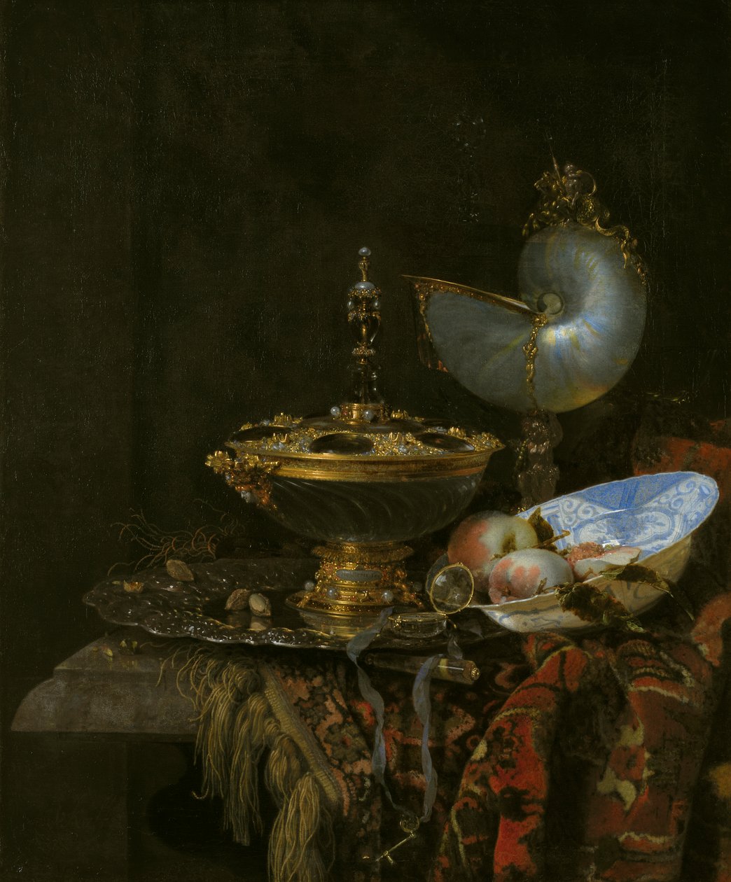 Prunkstillleben mit Holbeinschale, Nautiluspokal, Glaspokal und Obstschale von Willem Kalf