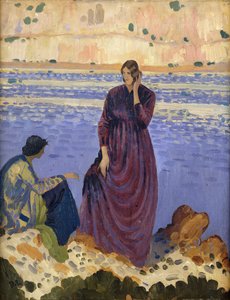 Zwei Frauen auf Felsen am Meer