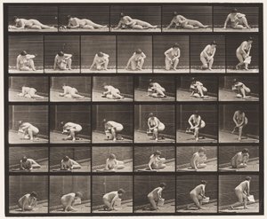 Vom Boden aufstehen mit Pamphlet in der linken Hand von Eadweard Muybridge