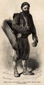 Ein Wasserträger, wandernder Händler, posiert mit seiner Ausrüstung, einer Art Tankbox und einem Behälter, der als Maß und Becher dient, in Roustchouk (Rumänien), Gravur nach einer Zeichnung von Emile Bayard, illustriert die Reise nach Bulgarien, von Guill
