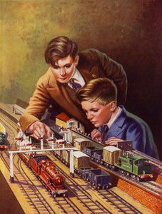 Jungen spielen mit einer Eisenbahn