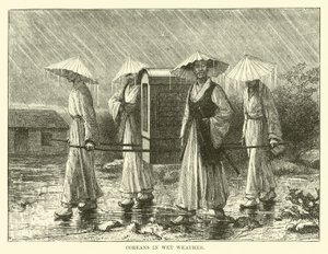 Koreaner bei nassem Wetter von English School