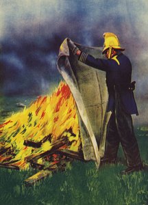 Feuerwehrmann experimentiert mit einer Asbest-Feuerdecke