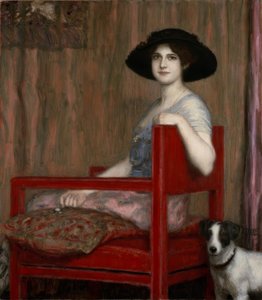 Mary von Stuck in einem roten Sessel von Franz von Stuck
