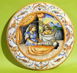 Geburtsteller zeigt das Neugeborene, das in Windeln gewickelt wird, aus Lyon (Faience)