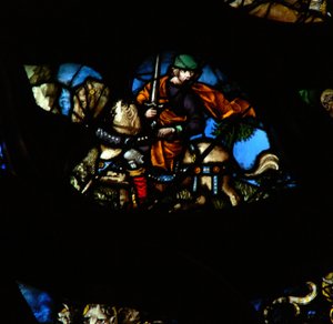 Das westliche Rosenfenster zeigt eine Szene aus dem Buch der Offenbarung: Ein Mann auf einem anderen Pferd (nicht rot, wie im Text) mit einem Schwert, um den Frieden von der Erde zu nehmen (6:4).