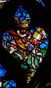 Das westliche Rosenfenster zeigt eine Szene aus dem Buch der Offenbarung: Abaddon oder Apollyon, der Engel des bodenlosen Abgrunds (9:11).