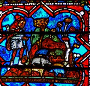 Fenster w17 zeigt eine Szene aus der Geschichte des verlorenen Sohnes: er findet Arbeit als Schweinehirt