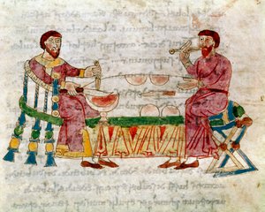 Zwei Männer bei einer Mahlzeit aus dem Band „De Mensis et Escis“, Manuskript „De Universo“ (oder De rerum naturis (Über die Natur der Dinge)) (cod. 132) von Rabanus Maurus Magnentius (ca. 780-856). 9. Jahrhundert. Archiv