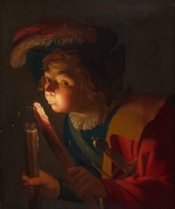 Ein Junge bläst auf einen Feuerbrand von Gerrit van Honthorst