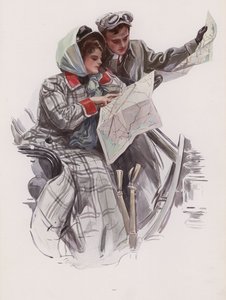 Mann und Frau lesen eine Karte in einem Auto
