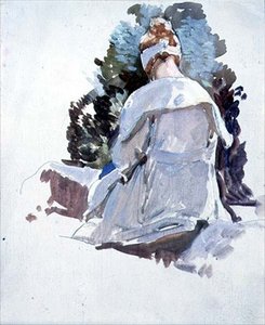 Frau in einem weißen Kleid, die auf Felsen sitzt