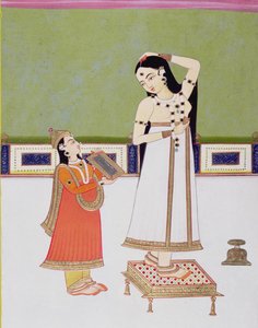 Indische Dame bei ihrer Toilette, die sich im Spiegel betrachtet