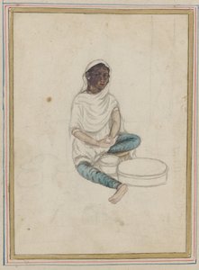 Frau beim Kornmahlen