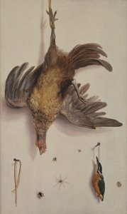 Eine Henne und ein Eisvogel an einer Schnur hängend
