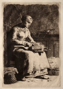 Frau beim Kardieren