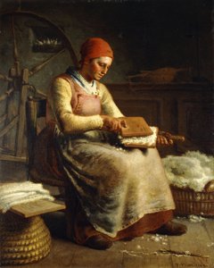 Frau beim Karden von Wolle