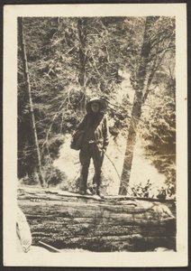 [Frau auf umgestürztem Baum stehend] von Louis Fleckenstein