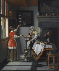Interieur mit einem Kind, das einen Papagei füttert