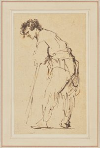 Junger Mann, der sich auf einen Stock lehnt von Rembrandt Harmensz. van Rijn