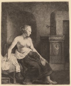 Frau sitzt halb angezogen neben einem Ofen von Rembrandt van Rijn