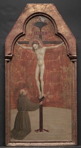 Der heilige Franziskus kniet vor Christus am Kreuz