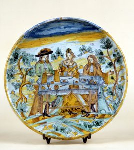 Darstellung eines Banketts im Freien auf einem Keramikteller von Talavera de la Reina (Spanien). Frühes 16. Jahrhundert. Mailand, Museo del Castello.