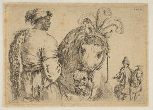 Ein Schwarzer füttert ein Pferd