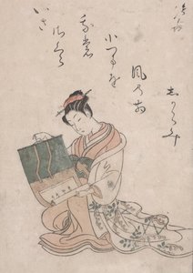 Schönheit, die eine Schriftrolle entrollt, ca. 1770 von Suzuki Harunobu