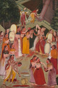 Mädchen besprühen sich gegenseitig beim Holi