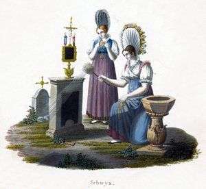 Zwei Frauen vor einem Grabstein auf einem Friedhof von Unbekannt