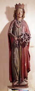 Darstellung der heiligen Katharina von Alexandria, die das Rad ihres Martyriums hält. Polychrome Holzstatue