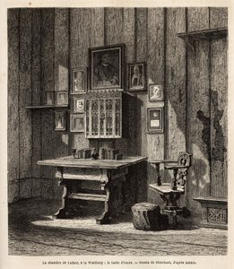 Martin Luthers Zimmer (1483-1546) auf der Wartburg, wo er nach seiner Exkommunikation im Jahr 1521 Zuflucht fand, mit seinem Porträt und denen seiner Eltern über dem Schreibtisch, unter deren Augen er die Bibel ins Deutsche übersetzte und seine berühmteste