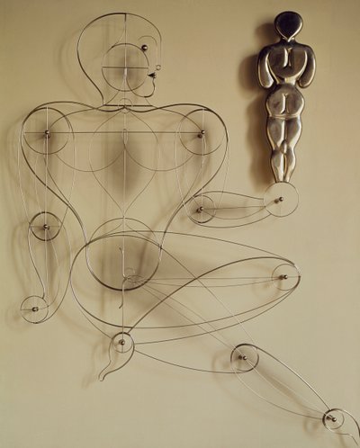 Homo, Drahtfigur mit Rückansichtfigur in der Hand von Oskar Schlemmer