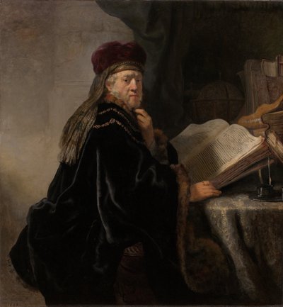 Ein Gelehrter sitzt an einem Schreibtisch von Rembrandt van Rijn