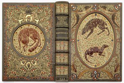 Ein juwelenbesetzter Zierdeckel mit Steinen, der mehrere Tiere darstellt von Sangorski and Sutcliffe