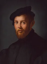 Porträt eines jungen Mannes mit einem Buch