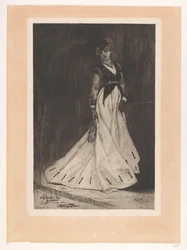 Stehende Frau mit Handschuhen und kleinem Hut