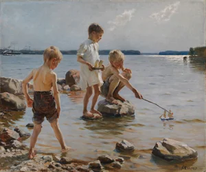 Jungen spielen am Ufer