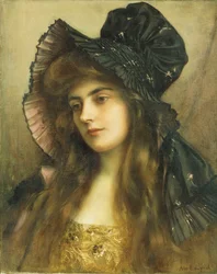 Eine junge Schönheit mit schwarzem Hut