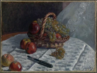 Äpfel und Trauben in einem Korb